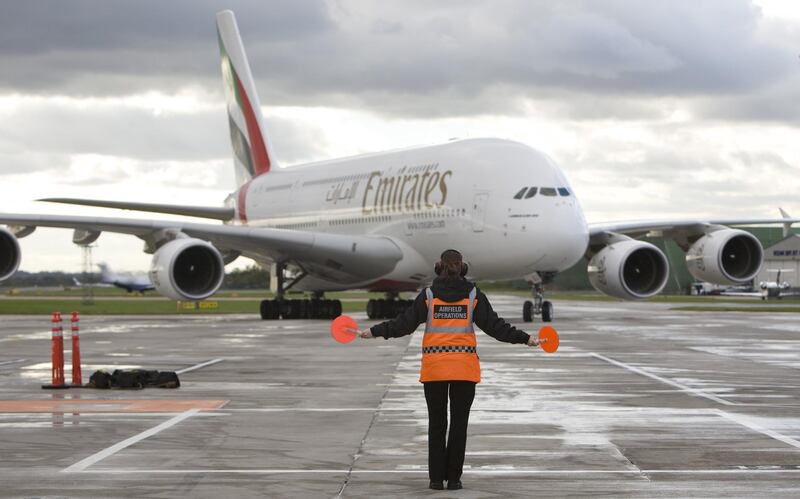 FILE: An Emirates Airline Airbus A380 airplane is directed on to a stand at Manchester airport in Manchester, U.K., on Thursday, Oct. 21, 2010. Airbus SE decided to stop making the A380 double-decker after a dozen years in service, burying a prestige project that won the hearts of passengers and politicians but never the broad support of airlines that instead preferred smaller, more fuel-efficient aircraft. Production of the jumbo jet will end by 2021, after the A380’s biggest customer, Emirates, and a handful of remaining buyers receive their last orders. Photographer: Chris Ratcliffe/Bloomberg