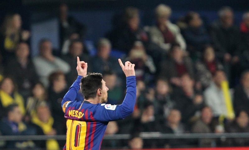 Barcelona forward Lionel Messi celebrates after scoring his side's third goal. AP Photo