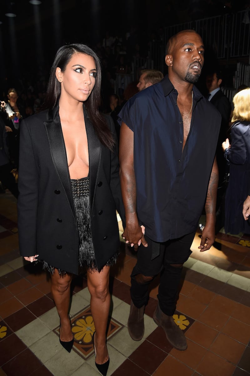 PARIS, FRANCE - SEPTEMBER 25:  Kim Kardashian and Kanye West attend the Lanvin show as part of the Paris Fashion Week Womenswear Spring/Summer 2015 on September 25, 2014 in Paris, France.  (Photo by Pascal Le Segretain/Getty Images)