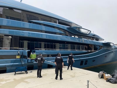 National Crime Agency officers seizing the superyacht Phi in London. Photo: PA 