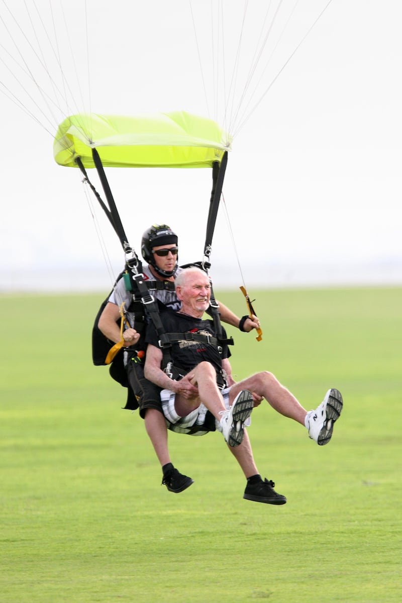 Dubai, United Arab Emirates, Apr 10, 2013 -  Dick Corbit, front, land after his parachute jump at skydive. Corbit is the oldest jumper to skydive at skydive Dubai and today is his 86 birthay. ( Jaime Puebla / The National Newspaper ) 