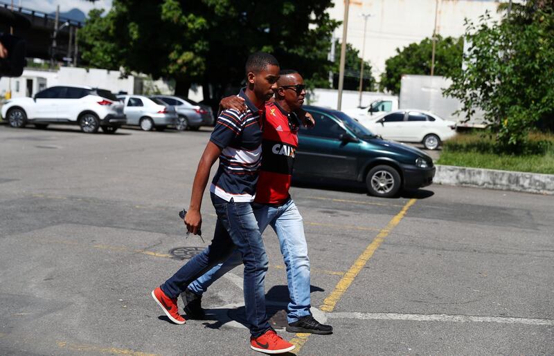 Relatives of Samuel Thomas Rosa, who was a victim of Flamengo soccer club's training center deadly fire, arrives at the Institute of Forensic Science, in Rio de Janeiro, Brazil. REUTERS