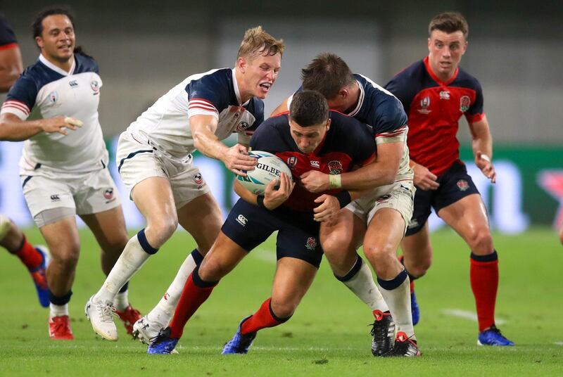 England's Ben Youngs is challenged at the Kobe Misaki Stadium. PA