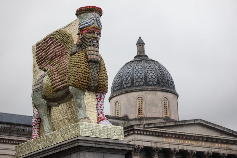 LONDON, ENGLAND - MARCH 28: The new fourth plinth sculpture titled 'The Invisible Enemy Should Not Exist' by Iraqi American artist Michael Rakowitz is unveiled in Trafalgar Square on March 28, 2018 in London, England. The work, which is a recreation of the Lamassu, a winged bull and protective deity, is made from 10,500 empty date syrup cans. (Photo by Jack Taylor/Getty Images)