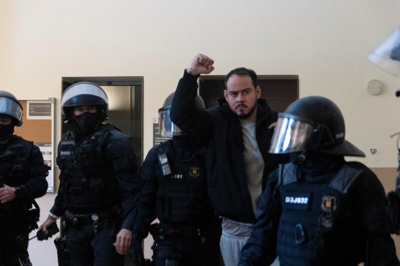 Spanish rapper Pablo Hasel reacts as he is detained by riot police inside the University of Lleida. Reuters