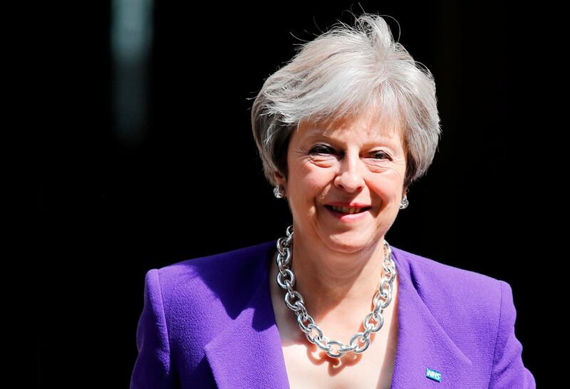 Britain's Prime Minister Theresa May leaves 10 Downing Street in London on July 4, 2018 ahead of the weekly Prime Minister's Questions (PMQs) session in the House of Commons. / AFP / Tolga AKMEN
