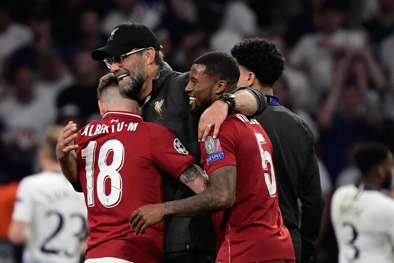 Klopp celebrates with Alberto Moreno and  Georginio Wijnaldum. AFP