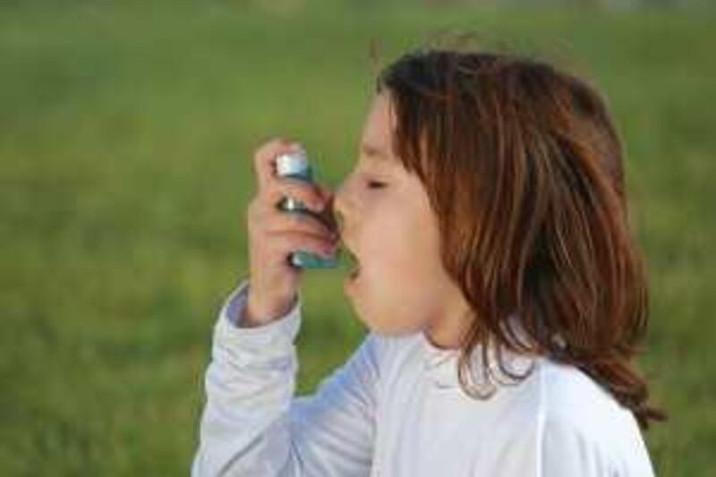 child using an asthma inhaler
istockphoto.com