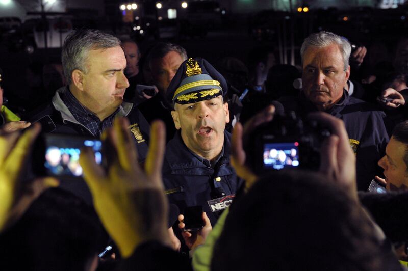 Colonel Timothy Albens (C), of the Massachusetts State Police, Boston Police Commissioner Ed Davis (L) and Watertown Chief of Police Edward P. Deveau (R) speak to the media as a search for the second of the two suspects wanted in the Boston Marathon bombings takes place on April 19, 2013 in Watertown, Massachusetts. A Boston marathon bombing suspect captured by police died in hospital, local television channels reported early Friday. Police have told residents of the town of Watertown near Boston to stay indoors and "stay away from windows" as they hunt a second suspect wanted for the attacks in which three people died and about 180 were injured.  AFP PHOTO/STAN HONDA
 *** Local Caption ***  943922-01-08.jpg