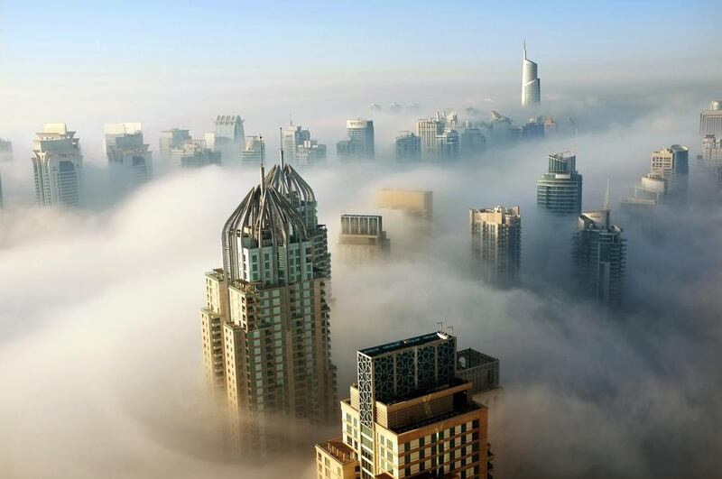 Thick morning fog clings to Dubai Marina on October 9, 2012. Mark Asquith / The National