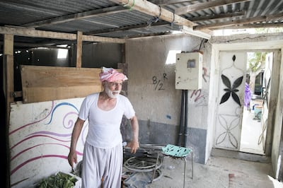 UMM AL QUWAIN, UNITED ARAB EMIRATES - SEPTEMBER 6, 2018. 

Ghulam Rasool, 75, outside his home in the old town of Umm Al Quwain.

One of the country's most affordable neighbourhoods for low income families and foreign workers, who have for generations called the old town home, will soon be demolished.


(Photo by Reem Mohammed/The National)

Reporter: RUBA HAZA
Section:  NA