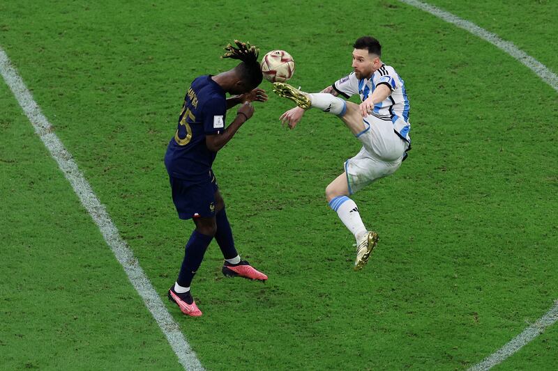 Argentina's Lionel Messi goes for a high challenge on Eduardo Camavinga of France. Getty