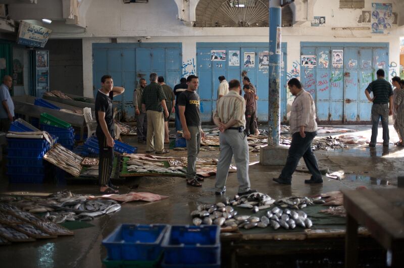 Gaza Port fish market. Making a living from fishing has become almost impossible for Gazan Fishermen. The Israeli navy has restricted fishing to within three nautical miles (approximately 5.5km) of shore.