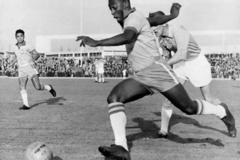 Brazilian forward Pele dribbles past a defender during a friendly soccer match between Malmoe and Brazil, 08 May 1960 in Malmoe. Pele scored two goals as Brazil won 7-1. AFP PHOTO