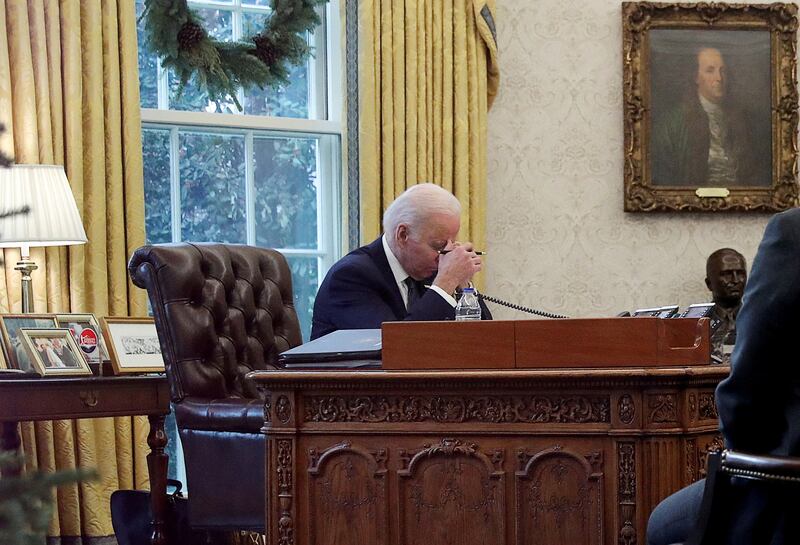 President Joe Biden speaks by phone with Ukraine's President Volodymyr Zelenskiy in the Oval Office at the White House on December 9, 2021. Reuters