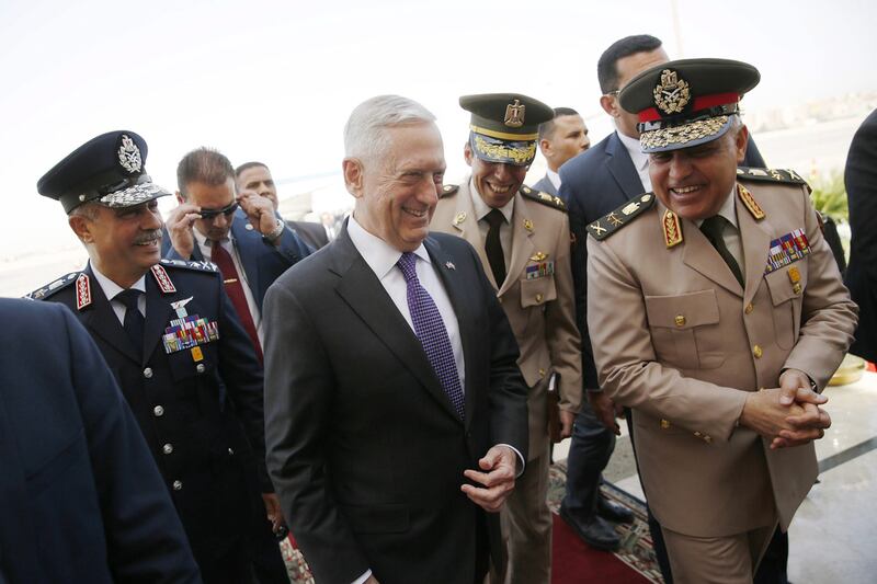 Egypt's minister of defence Sedki Sobhi, right, greets US defence secretary James Mattis, centre, upon his arrival at Cairo International Airport on April 20, 2017 in Cairo, Egypt. Jonathan Ernst - Pool/Getty Images