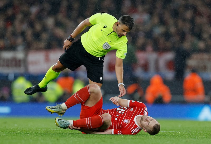 Bayern Munich's Matthijs de Ligt goes down injured. Reuters