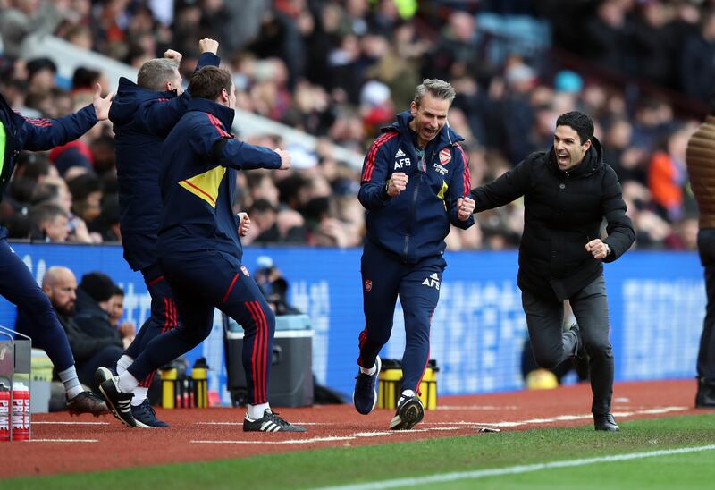 Arsenal manager Mikel Arteta (right) celebrates his side's third goal. PA