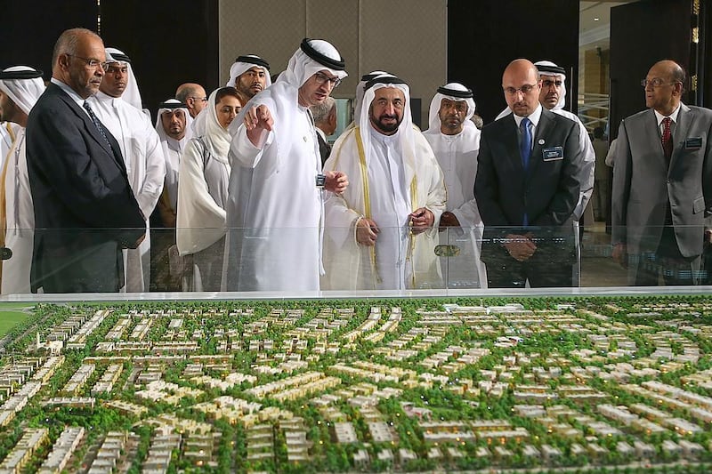Dr Sheikh Sultan bin Mohammed Al Qasimi, the Ruler of Sharjah, takes a look at a scale model of the Al Zahia Projects during the Sharjah FDI Forum on Wednesday. Satish Kumar / The National