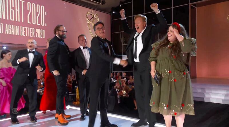 Stephen Colbert, third from right, looks at Conan O'Brien as he goes on stage to accept the award for Outstanding Variety Special (live) for 'Stephen Colbert's Election Night 2020: Democracy's Last Stand Building Back America Great Again Better 2020'.  AP