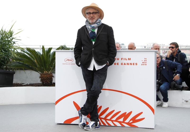 Palestinian director Elia Suleiman poses during the photocall for 'It Must Be Heaven' at the 72nd annual Cannes Film Festival. The movie is presented in the Official Competition of the festival which runs from May 14-25.  EPA/Ian Langsdon