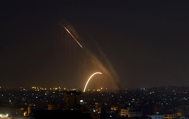 Rockets are launched from the Gaza Strip towards Israel, Wednesday, Nov. 13, 2019.  Israeli aircraft have struck Islamic Jihad targets throughout the Gaza Strip while the militant group rained scores of rockets into Israel for a second straight day as the heaviest round of fighting in months showed no signs of ending.  (AP Photo/Khalil Hamra)
