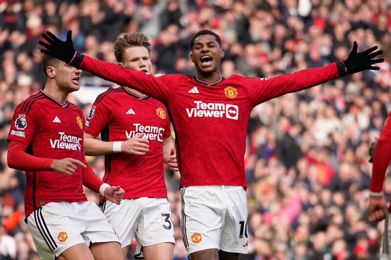 Manchester United's Marcus Rashford, right, celebrates after scoring his side's second goal with a penalty kick during an English Premier League soccer match between Manchester United and Everton at the Old Trafford stadium in Manchester, England, Saturday, March 9, 2024.  (AP Photo / Dave Thompson)