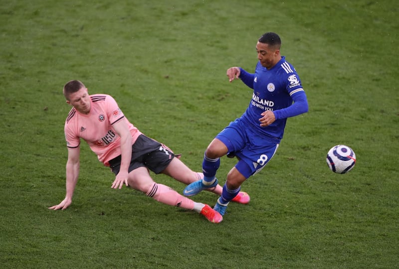 Sheffield United's John Lundstram is booked for fouling Youri Tielemans of Leicester. Reuters