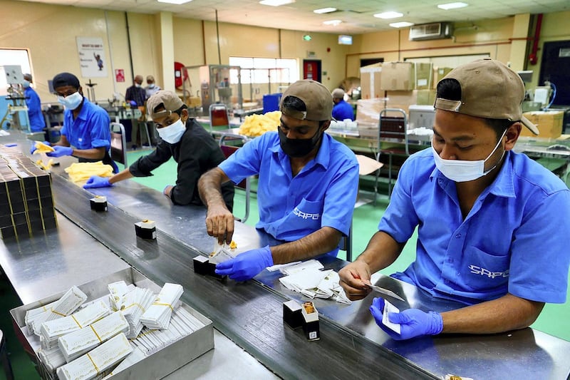 SHARJAH, UNITED ARAB EMIRATES , April 14  – 2021 :- Workers packing the perfumes at the Swiss Arabian perfume and Bakhoor factory in Sharjah. ( Pawan Singh / The National ) For News/Online/Instagram. Story by Kelly