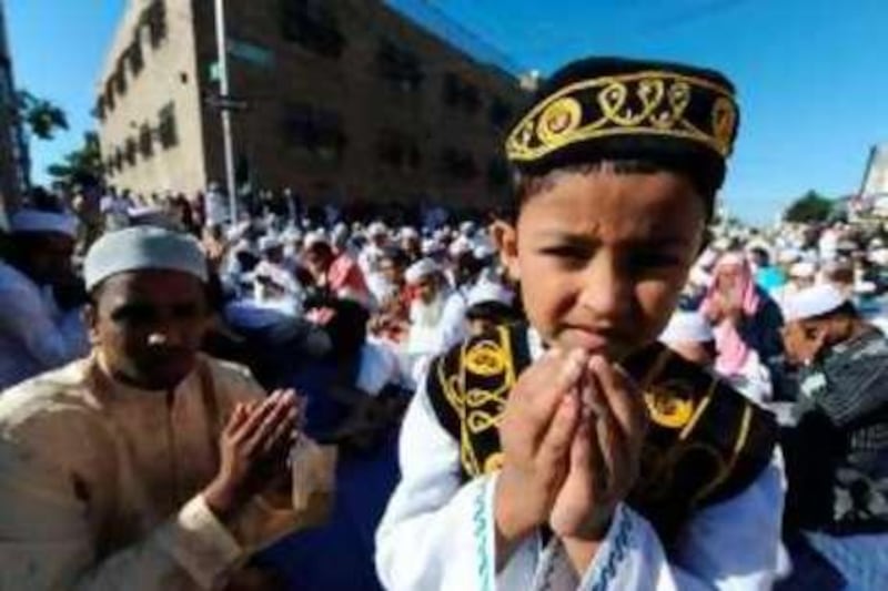 Muslim devotees take part in a special morning prayer to start the Eid al-Fitr festival, which marks the end of Muslim's holy fasting month of Ramadan, on September 20, 2009 in Brooklyn, New York. US President Barack Obama marked the end of the Muslim holy month of Ramadan with his administration stressing the commonality between American culture and the values of Islam. AFP PHOTO/Jewel SAMAD