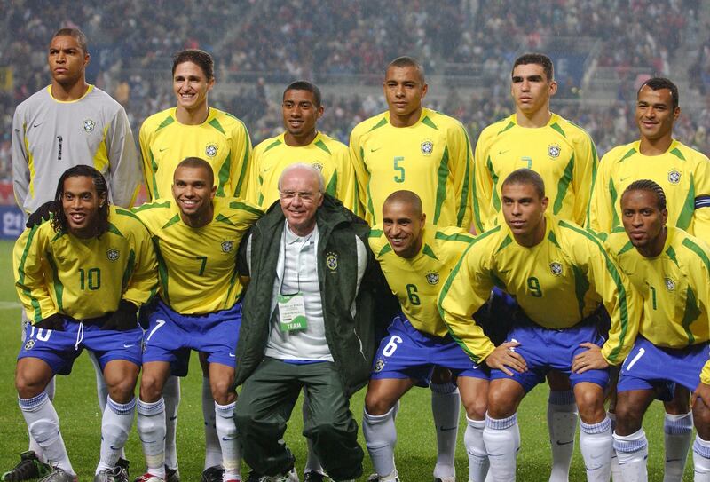 Brazilian football team caretaker coach Mario Zagallo poses with his starting line-up in Seoul in 2002. AFP