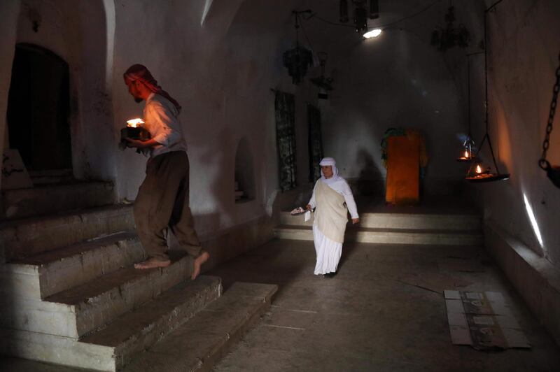 Iraqi Yezidis visit the Temple of Lalish, in a valley near the Kurdish city of Dohuk about 430km northwest of the capital Baghdad, on July 16, 2019. AFP