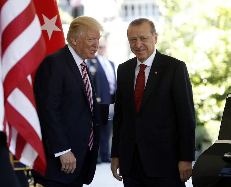 US president Donald Trump welcomes Turkish president Recep Tayyip Erdogan to the White House in Washington on May 16, 2017. The two men discussed over the phone on Saturday working more closely together to improve regional security. Pablo Martinez Monsivais / The Associated Press