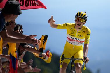 Slovenia's Tadej Pogacar, wearing the overall leader's yellow jersey, celebrates as he crosses the finish line to win the seventh stage of the Tour de France cycling race over 176. 5 kilometers (109. 7 miles) with start Tomblaine and finish in La Super Planche des Belles Filles, France, Friday, July 8, 2022.  (AP Photo / Daniel Cole)