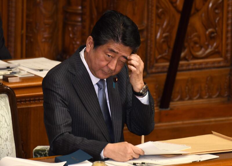 Japan's Prime Minister Shinzo Abe gestures after his answer questions to an opposition party member during the plenary session of the upper house of parliament in Tokyo on December 4, 2017. 
Abe pledged Tokyo will use the UN Security Council chairmanship this month to "lead" global efforts over the North Korean crisis as regional tention heats up.  / AFP PHOTO / KAZUHIRO NOGI