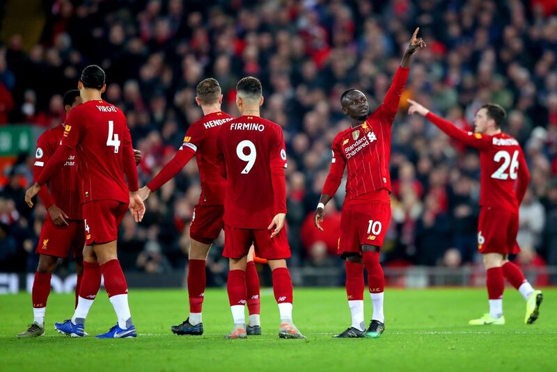 Liverpool's Sadio Mane (second right) celebrates scoring his side's only goal. PA