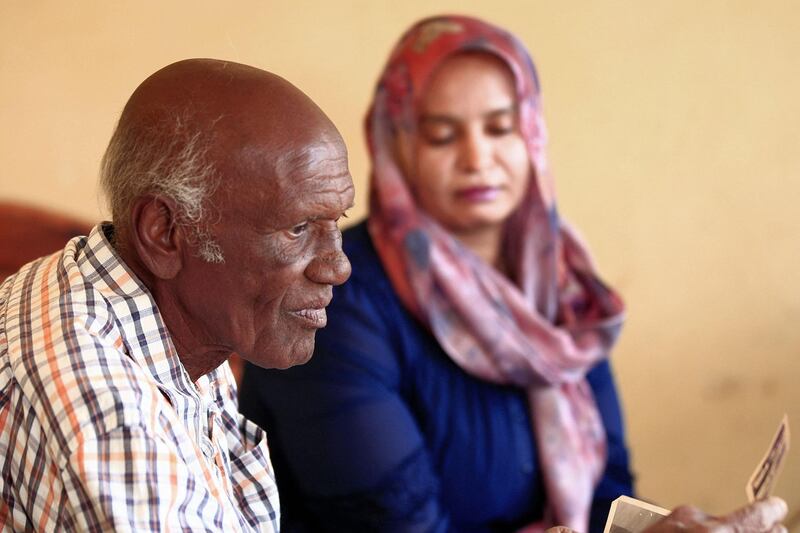 Amin Israil, the grandson of an Iraqi Jew who settled in Sudan and whose family later converted to Islam, and his daughter Salma view old family pictures at their home in Wad Madani, the capital of Sudan's Al Jazirah state. Like elsewhere in the Arab world, Sudanese Jews bore the brunt of growing anti-Israel sentiment amid conflict with the Jewish state. Decades later, their descendants see a recent rapprochement between their country and Israel as an opportunity to connect with their origins. AFP