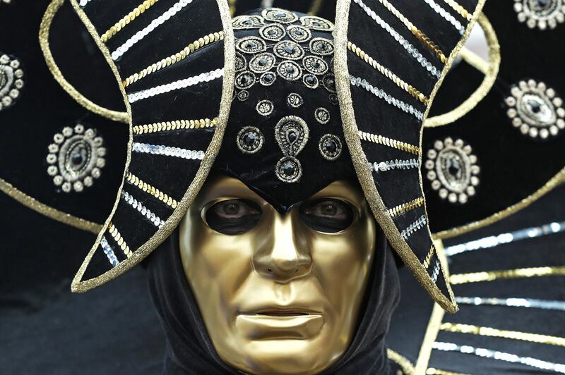 A masked reveller poses during the Venice Carnival in Venice, Italy. Reuters