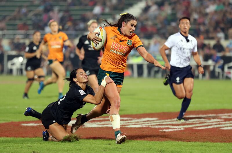 Australia's Charlotte Caslick is tackled.