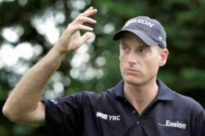 Defending champion Jim Furyk of the U.S. gestures after teeing off on the 10th hole during the Pro-Am round at the Canadian Open golf tournament at Glen Abbey Golf Club in Oakville July 23, 2008.
   REUTERS/Mike Cassese   (CANADA)
Picture Supplied by Ac... *** Local Caption *** 2008-07-23T200642Z_01_MJC23_RTRIDSP_3_GOLF-PGA-CANADA.jpg