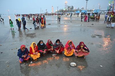 Pilgrims perform rituals during the Hindu religious festival of Gangasagar Mela on Sagar Island, West Bengal. AFP