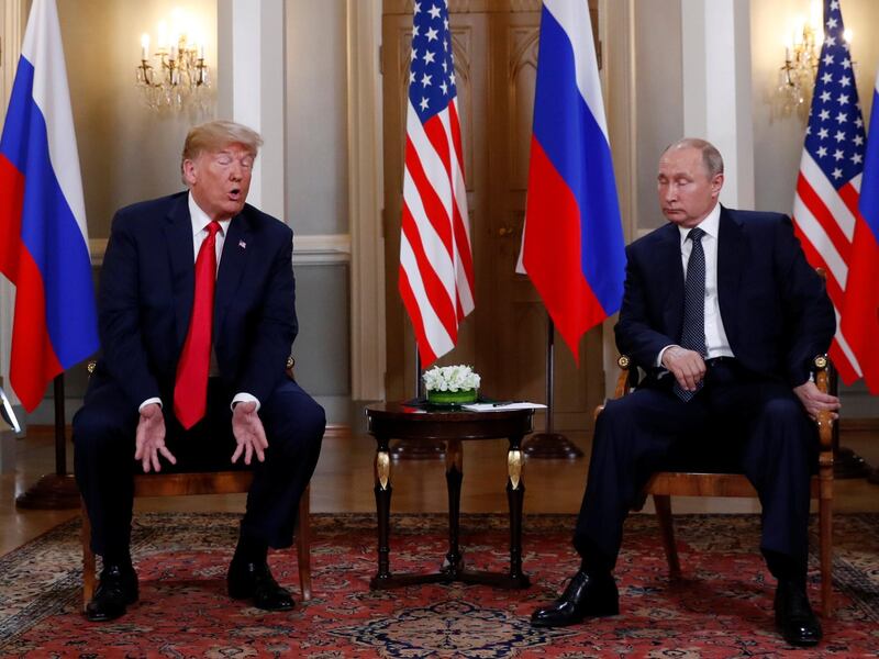 U.S. President Donald Trump and Russia's President Vladimir Putin talk in Helsinki. Reuters