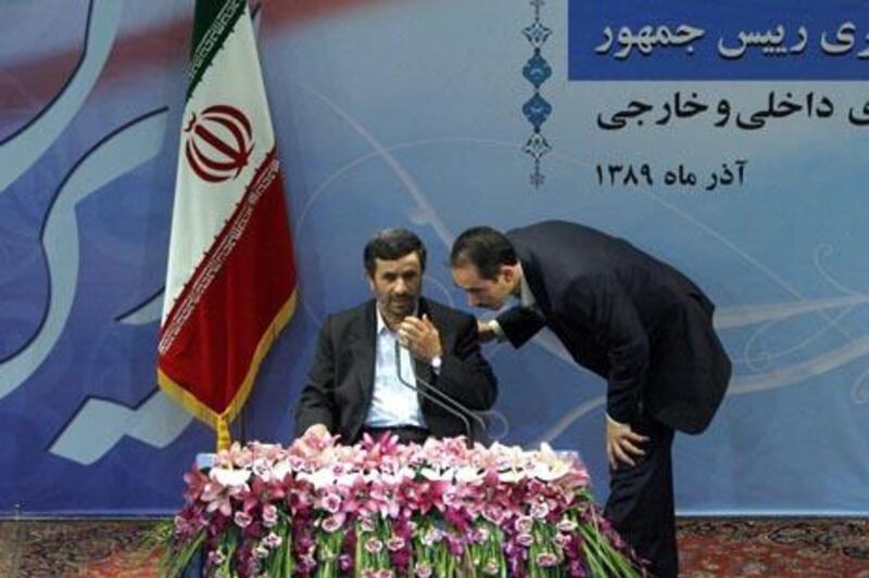 epa02472958 Iranian President Mahmoud Ahmadinejad (seated L) speaks with a bodyguard  during a press conference in Tehran, Iran, on 29 November 2010. Ahmadinejad said that the WikiLeaks documents were worthless and would not have any impact on Iran's relations with some Arab countries. ''These documents follow certain political aims and are some sort of intelligence game and therefore without any legal basis,'' he added. According to the WikiLeaks documents, Saudi Arabia and Bahrain have been urging the United States to halt Iran's nuclear programme by any means, including through military means.  EPA/ABEDIN TAHERKENAREH  EPA/ABEDIN TAHERKENAREH