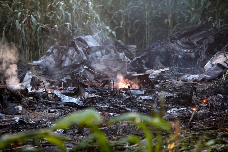 Smouldering debris at the crash near the village of Palaiochori, west of Kavala International Airport.  AP