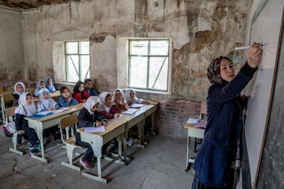 A teacher leads a girl's class in Kabul. The Taliban's hostility to girls' education, as well as other abuses, led to sanctions and the withholding of aid, but these policies maintain the stalemate and do little to persuade the militants to change their behaviour. AP