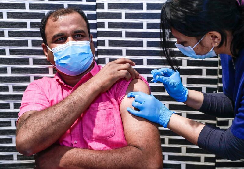 Abu Dhabi, United Arab Emirates, March 30, 2021.  Sulaiman Kalathul gets vaccinated at the  Biogenix Labs at G42 in Masdar City.  As of March 25, Biogenix Labs now administers the Sinopharm Covid vaccine.
Victor Besa/The National
Section:  NA
Reporter:  Shireena Al Nowais
