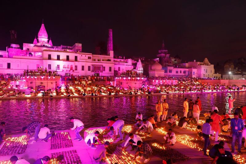 People light lamps on the banks of the river Sarayu to celebrate Diwali in Ayodhya, India. AP