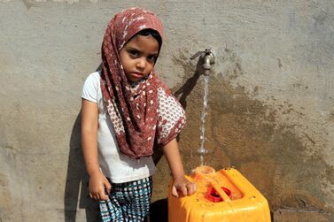 A Yemeni girl fills a jerry can with drinking water in north Hodeidah on March 25, 2019. Reuters