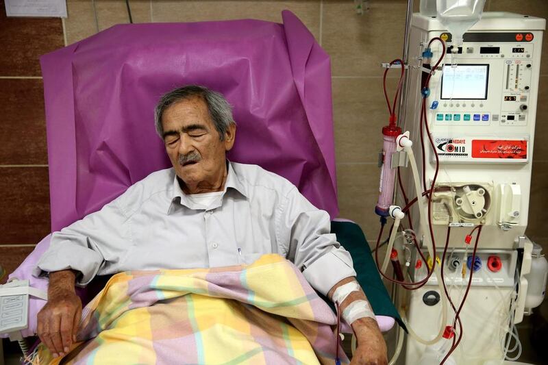 Hassan Hamdampay uses a dialysis machine at a clinic in downtown Tehran on August 6, 2016. Ebrahim Noroozi/AP Photo