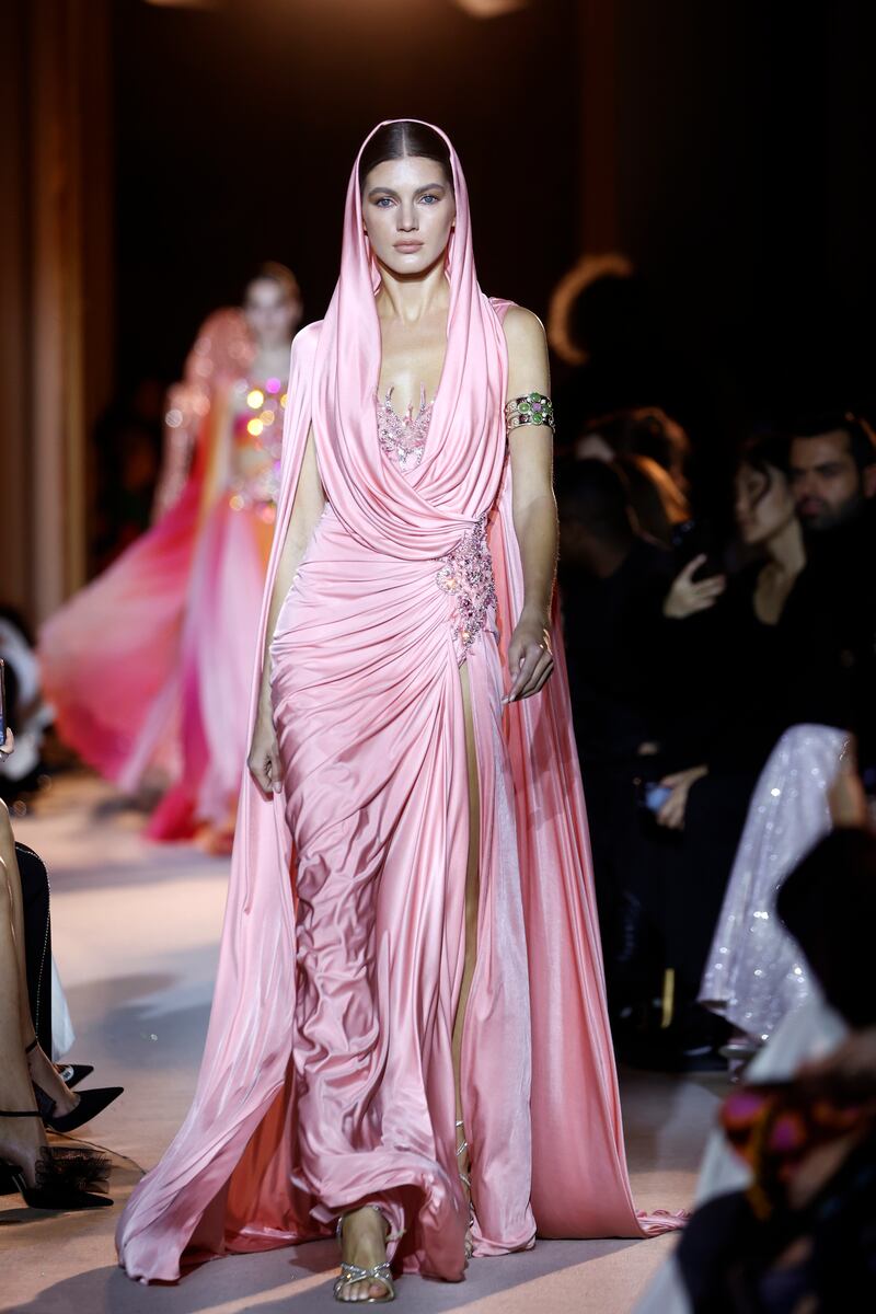 A cowled, hooded dress in soft pink at Zuhair Murad. Getty Images